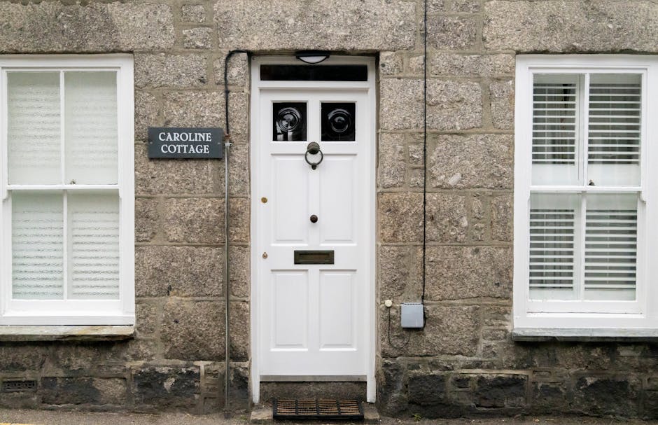 Stone holiday cottage in the UK countryside with a dog in the garden — typical HolidayCottages.co.uk pet-friendly property